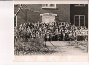 Photo of  congregation in front of building on Kendall Street (1953)